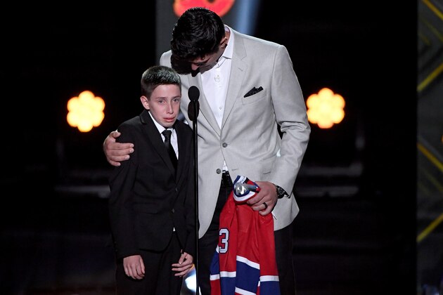 LAS VEGAS, NEVADA - JUNE 19: Carey Price of the Montreal Canadiens presents friend Anderson Whitehead a jersey and a trip to the 2020 NHL All-Star game during the 2019 NHL Awards at the Mandalay Bay Events Center on June 19, 2019 in Las Vegas, Nevada. (Photo by Ethan Miller/Getty Images)