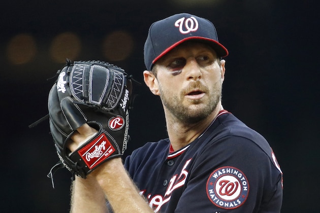 Washington Nationals starting pitcher Max Scherzer prepares to throw to the Philadelphia Phillies in the first inning of the second baseball game of a doubleheader, Wednesday, June 19, 2019, in Washington. (AP Photo/Patrick Semansky)
