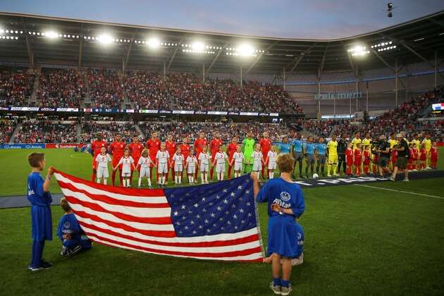 Players of USA (L) and Guyana (R) stand for the National anthem ahead of the 2019 CONCACAF Gold Cup Group D match between USA and Guyana on June 18, 2019 at Allianz Field in Saint Paul, Minnesota. (Photo by Kerem Yucel / AFP)        (Photo credit should read KEREM YUCEL/AFP/Getty Images)