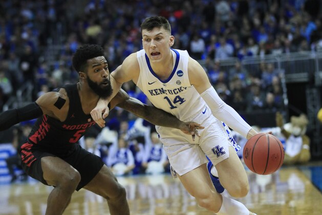 Kentucky's Tyler Herro (14) drives past Houston's Corey Davis Jr. during the first half of a men's NCAA tournament college basketball Midwest Regional semifinal game Friday, March 29, 2019, in Kansas City, Mo. (AP Photo/Orlin Wagner)