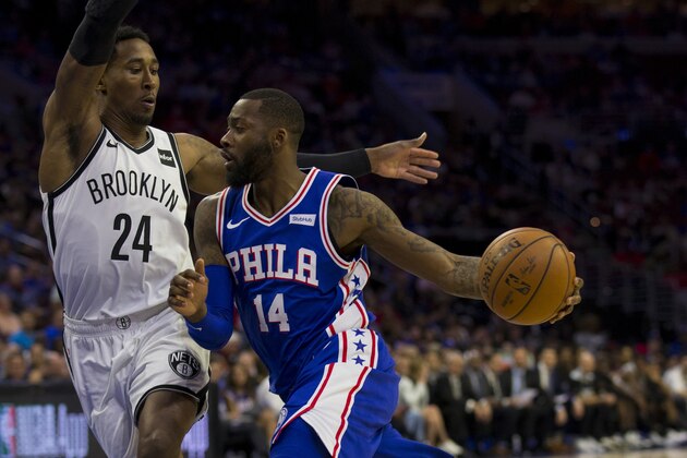 PHILADELPHIA, PA - APRIL 23: Jonathon Simmons #14 of the Philadelphia 76ers dribbles the ball against Rondae Hollis-Jefferson #24 of the Brooklyn Nets in Game Five of Round One of the 2019 NBA Playoffs at the Wells Fargo Center on April 23, 2019 in Philadelphia, Pennsylvania. NOTE TO USER: User expressly acknowledges and agrees that, by downloading and or using this photograph, User is consenting to the terms and conditions of the Getty Images License Agreement. (Photo by Mitchell Leff/Getty Images)