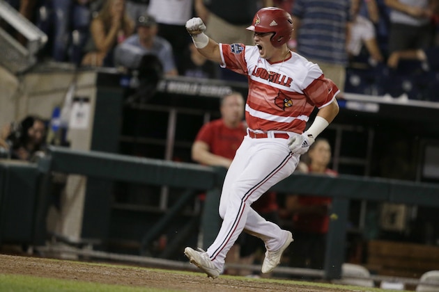 Louisville's Danny Oriente celebrates after scoring the winning run against Mississippi State on a single by Drew Campbell in the ninth inning of an NCAA College World Series baseball game in Omaha, Neb., Thursday, June 20, 2019. Louisville won 4-3. (AP Photo/Nati Harnik)