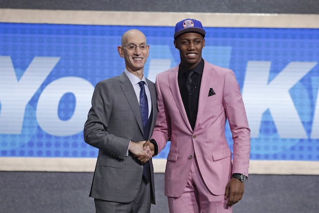 Duke's RJ Barrett, right, poses for photographs with NBA Commissioner Adam Silver after being selected as the third pick overall by the New York Knicks during the NBA basketball draft Thursday, June 20, 2019, in New York. (AP Photo/Julio Cortez)