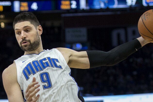 Orlando Magic center Nikola Vucevic grabs a rebound during the second half of the team's NBA basketball game against Memphis Grizzlies in Orlando, Fla., Friday, March 22, 2019. The Magic won 123-119 in overtime. (AP Photo/Willie J. Allen Jr.)