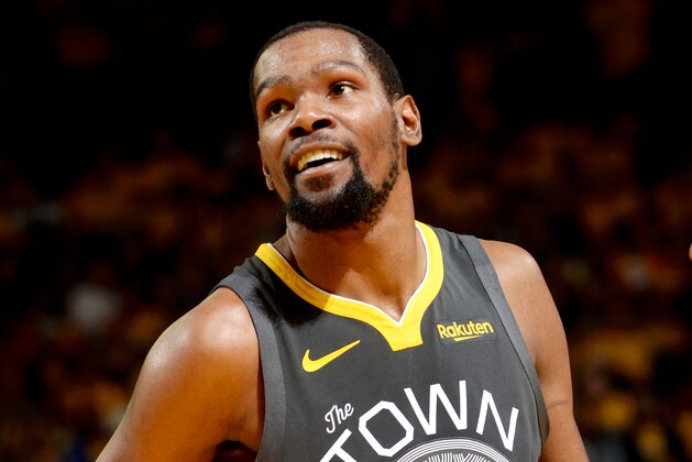 OAKLAND, CA - APRIL 30:  Kevin Durant #35 of the Golden State Warriors smiles during Game Two of the Western Conference Semifinals of the 2019 NBA Playoffs on April 30, 2019 at ORACLE Arena in Oakland, California. NOTE TO USER: User expressly acknowledges and agrees that, by downloading and or using this photograph, user is consenting to the terms and conditions of Getty Images License Agreement. Mandatory Copyright Notice: Copyright 2019 NBAE (Photo by Noah Graham/NBAE via Getty Images)