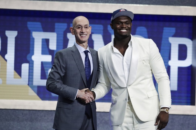 Duke's Zion Williamson, right, poses for photographs with NBA Commissioner Adam Silver after being selected by the New Orleans Pelicans as the first pick during the NBA basketball draft Thursday, June 20, 2019, in New York. (AP Photo/Julio Cortez)
