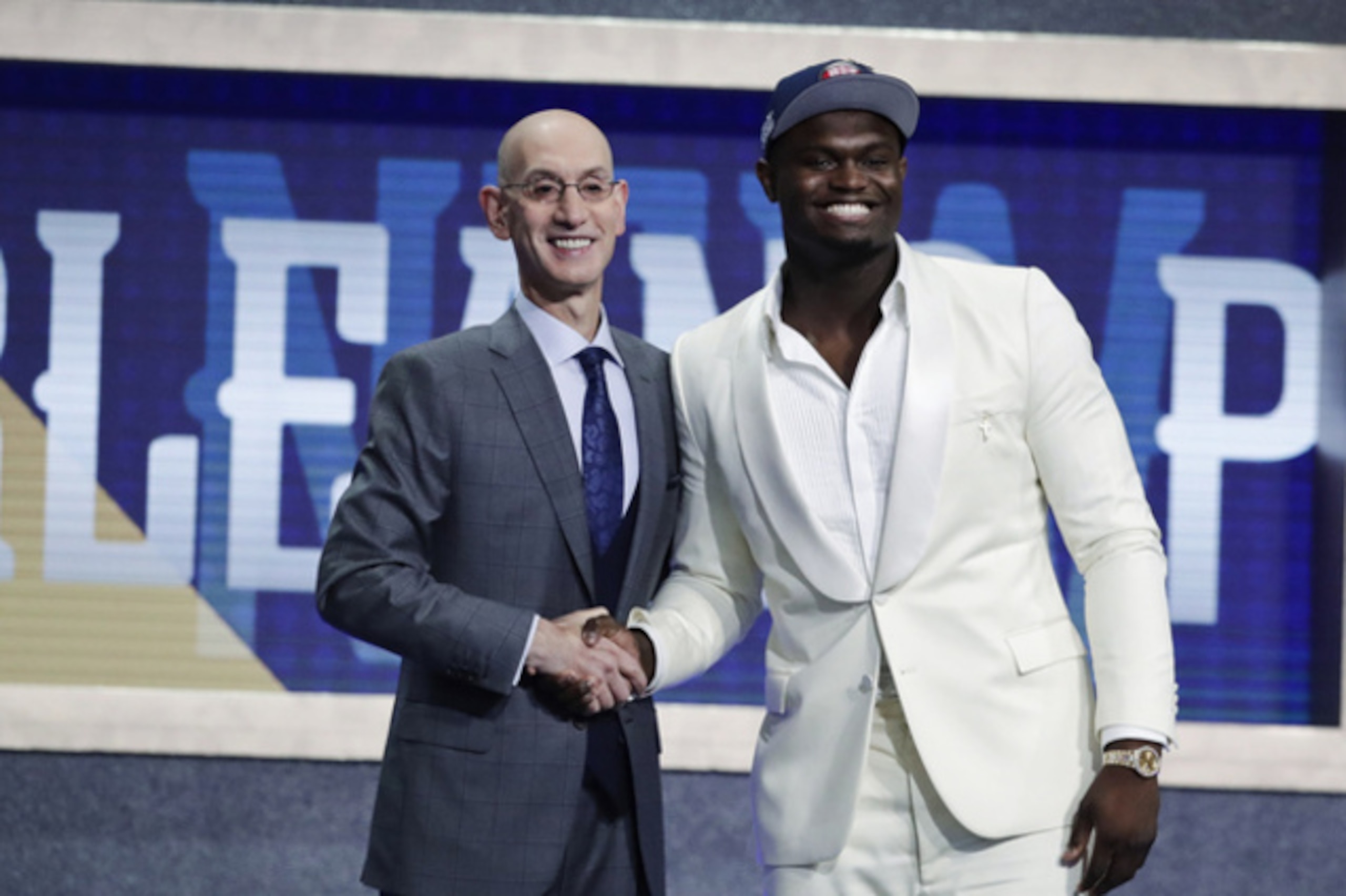 Duke's Zion Williamson, right, poses for photographs with NBA Commissioner Adam Silver after being selected by the New Orleans Pelicans as the first pick during the NBA basketball draft Thursday, June 20, 2019, in New York. (AP Photo/Julio Cortez)