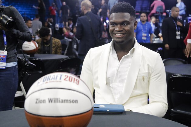 Zion Williamson, of Duke, smiles before the NBA basketball draft Thursday, June 20, 2019, in New York. (AP Photo/Julio Cortez)