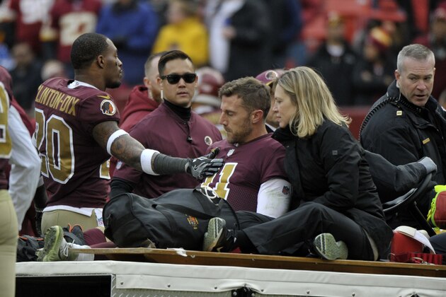 Washington Redskins free safety Ha Ha Clinton-Dix (20) consoles quarterback Alex Smith (11) after Smith's leg injury during an NFL football game against the Houston Texans, Sunday, Nov. 18, 2018, in Landover, Md. (AP Photo/Mark Tenally)