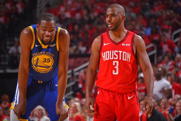 HOUSTON, TX - MAY 6: Kevin Durant #35 of the Golden State Warriors and Chris Paul #3 of the Houston Rockets smile during Game Four of the Western Conference Semifinals of the 2019 NBA Playoffs on May 6, 2019 at the Toyota Center in Houston, Texas. NOTE TO USER: User expressly acknowledges and agrees that, by downloading and/or using this photograph, user is consenting to the terms and conditions of the Getty Images License Agreement. Mandatory Copyright Notice: Copyright 2019 NBAE (Photo by Bill Baptist/NBAE via Getty Images)