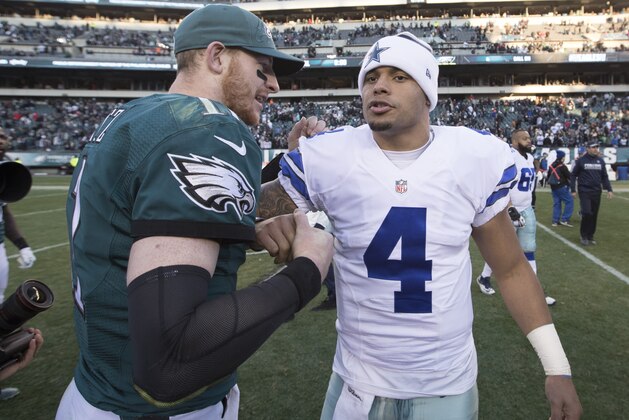 PHILADELPHIA, PA - JANUARY 1: Carson Wentz #11 of the Philadelphia Eagles hugs Dak Prescott #4 of the Dallas Cowboys after the game at Lincoln Financial Field on January 1, 2017 in Philadelphia, Pennsylvania. The Eagles defeated the Cowboys 27-13. (Photo by Mitchell Leff/Getty Images)