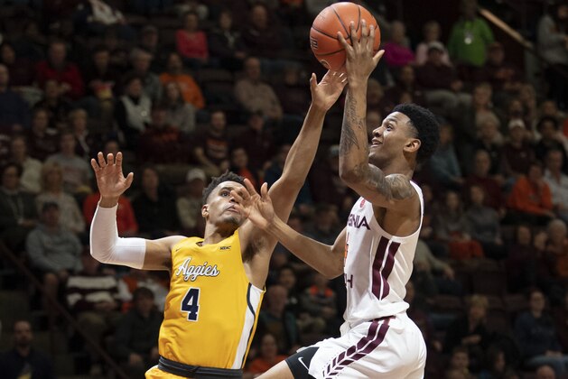 Virginia Tech guard Nickeil Alexander-Walker (4) goes up for a basket against North Carolina A&T forward Terry Harris (4) during the second half of an NCAA college basketball game Wednesday, Dec.19, 2018, in Blacksburg, Va.  (AP Photo/Don Petersen)