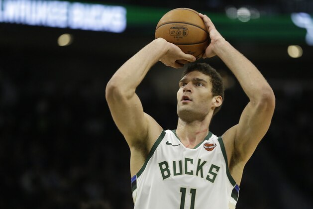 Milwaukee Bucks' Brook Lopez shoots a free throw during the second half of an NBA basketball game against the Orlando Magic Saturday, Feb. 9, 2019, in Milwaukee. (AP Photo/Aaron Gash)