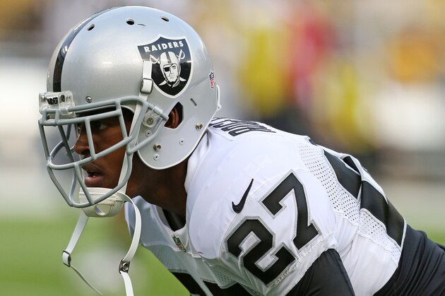 GREEN BAY, WI - AUGUST 22: Carlos Rogers #27 of the Oakland Raiders warms up prior to a preseason game against the Green Bay Packers at Lambeau Field on August 22, 2014 in Green Bay, Wisconsin. The Packers defeated the Raiders 31-21. (Photo by John Konstantaras/Getty Images)