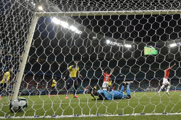 Ecuador's goalkeeper Alexander Dominguez fails to stop a goal by Chile's Alexis Sanchez (out of frame) during their Copa America football tournament group match at the Fonte Nova Arena in Salvador, Brazil, on June 21, 2019. (Photo by Raul ARBOLEDA / AFP)        (Photo credit should read RAUL ARBOLEDA/AFP/Getty Images)