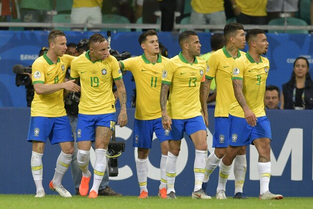 (L-R) Brazil's Arthur, Everton, Philippe Coutinho, Dani Alves, Roberto Firmino and Gabriel Jesus react as they were celebrating a goal by Philippe Coutinho against Venezuela after Chilean referee Julio Bascunan (out of frame) talks to referees of the VAR, moments before disallowing a goal for the second time during their Copa America football tournament group match at the Fonte Nova Arena in Salvador, Brazil, on June 18, 2019. (Photo by Raul ARBOLEDA / AFP)        (Photo credit should read RAUL ARBOLEDA/AFP/Getty Images)