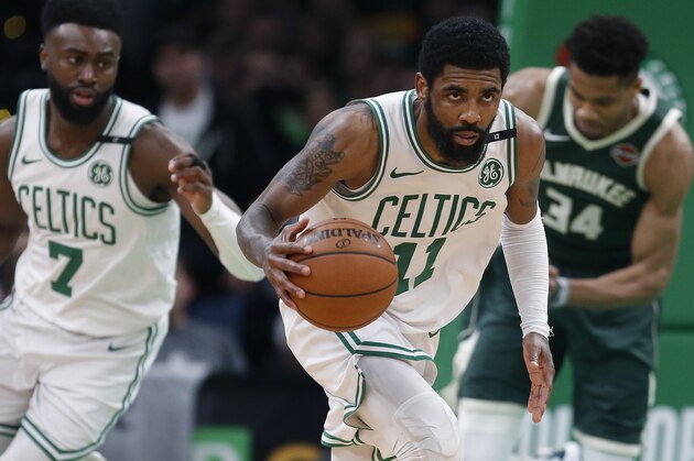 Boston Celtics' Kyrie Irving (11) brings the ball up court during the second half of Game 4 of a second round NBA basketball playoff series against the Milwaukee Bucks in Boston, Monday, May 6, 2019. (AP Photo/Michael Dwyer)