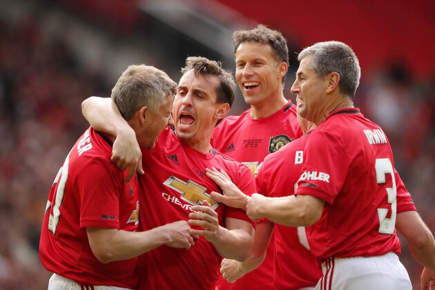 MANCHESTER, ENGLAND - MAY 26: Ole Gunnar Solskjaer of Manchester United '99 Legends  celebrates after scoring a goal to make it 1-0 with Gary Neville during the Manchester United '99 Legends v FC Bayern Legends match at Old Trafford on May 26, 2019 in Manchester, England. (Photo by Matthew Ashton - AMA/Getty Images)