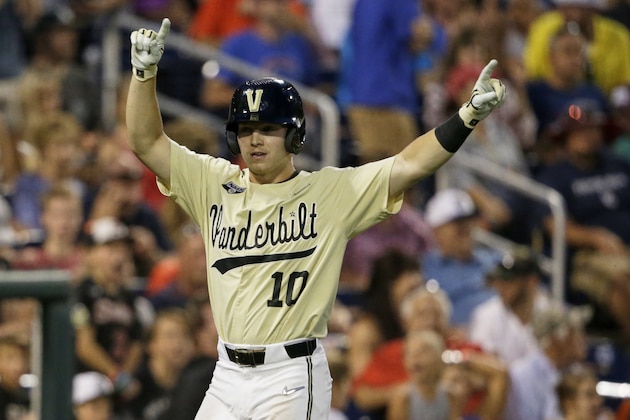 Vanderbilt's Ethan Paul celebrates after scoring the go-ahead run against Louisville diromg the ninth inning of an NCAA College World Series baseball game in Omaha, Neb., Friday, June 21, 2019. Vanderbilt won 3-2. (AP Photo/Nati Harnik)