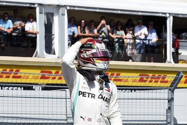 Mercedes' British driver Lewis Hamilton stands on his car to celebrate winning the pole position after the qualifying session at the Circuit Paul Ricard in Le Castellet, southern France, on June 22, 2019, ahead of the Formula One Grand Prix de France. (Photo by Boris HORVAT / AFP)        (Photo credit should read BORIS HORVAT/AFP/Getty Images)
