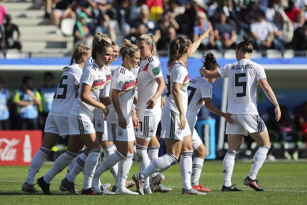 Germany players celebrate after teammate Sara Daebritz scored their side's second goal during the Women's World Cup round of 16 soccer match between Germany and Nigeria at Stade del Alpes in Grenoble, France, Saturday, June 22, 2019. (AP Photo/Laurent Cipriani)