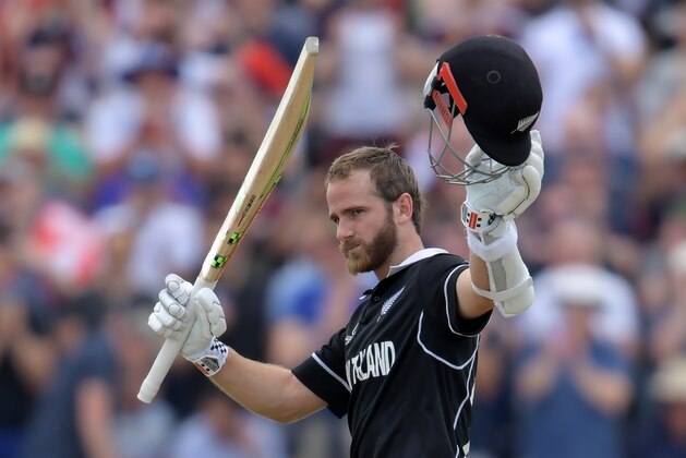 New Zealand's captain Kane Williamson celebrates after scoring a century (100 runs) during the 2019 Cricket World Cup group stage match between West Indies and New Zealand at Old Trafford in Manchester, northwest England, on June 22, 2019. (Photo by Dibyangshu Sarkar / AFP) / RESTRICTED TO EDITORIAL USE        (Photo credit should read DIBYANGSHU SARKAR/AFP/Getty Images)