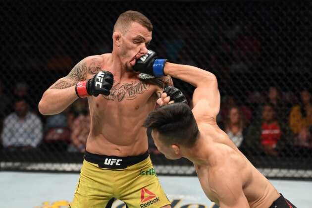 GREENVILLE, SC - JUNE 22:  (R-L) Chan Sung Jung of South Korea punches Renato Moicano of Brazil in their featherweight bout during the UFC Fight Night event at Bon Secours Wellness Arena on June 22, 2019 in Greenville, South Carolina. (Photo by Josh Hedges/Zuffa LLC/Zuffa LLC via Getty Images)