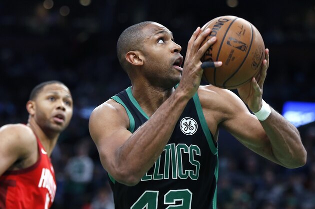 Boston Celtics' Al Horford (42) looks to shoot during the first half of an NBA basketball game against the Houston Rockets in Boston, Sunday, March 3, 2019. (AP Photo/Michael Dwyer)