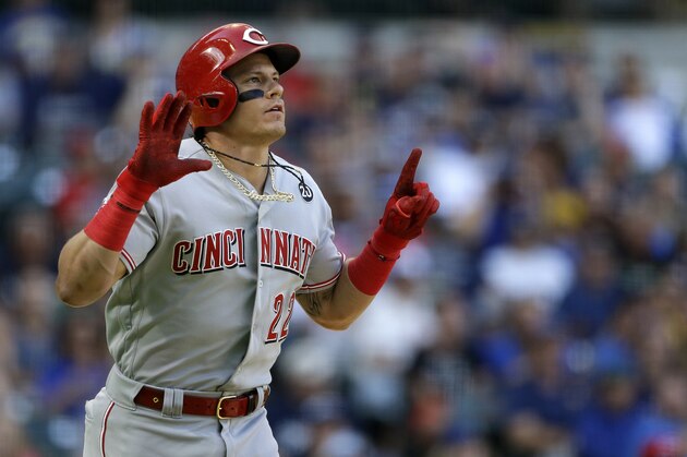 Cincinnati Reds' Derek Dietrich gestures after being hit by a pitch during the fifth inning of a baseball game against the Milwaukee Brewers Saturday, June 22, 2019, in Milwaukee. (AP Photo/Aaron Gash)