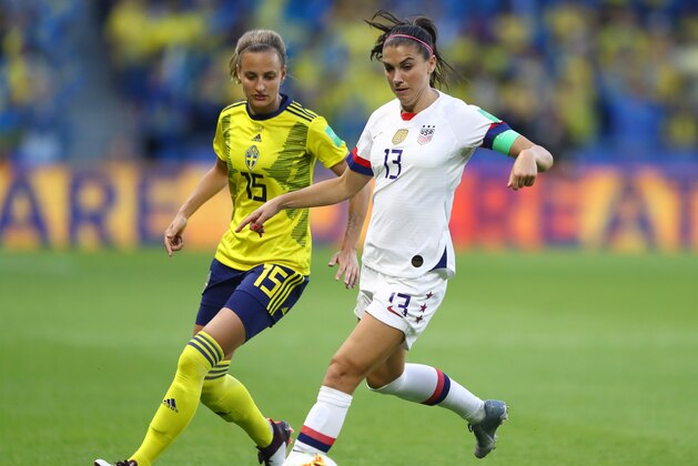 LE HAVRE, FRANCE - JUNE 20: Alex Morgan of the USA battles for possession with Nathalie Bjorn of Sweden during the 2019 FIFA Women's World Cup France group F match between Sweden and USA at Stade Oceane on June 20, 2019 in Le Havre, France. (Photo by Martin Rose/Getty Images)