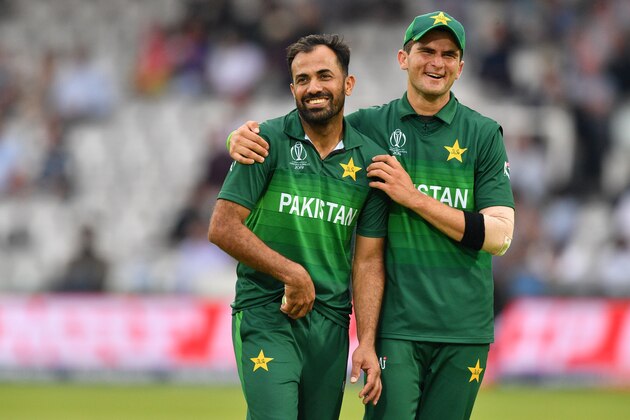 Pakistan's Wahab Riaz (L) celebrates with teammate Shaheen Shah Afridi after the dismissal of South Africa's Lungi Ngidi during the 2019 Cricket World Cup group stage match between Pakistan and South Africa at Lord's Cricket Ground  in London on June 23, 2019. (Photo by SAEED KHAN / AFP) / RESTRICTED TO EDITORIAL USE        (Photo credit should read SAEED KHAN/AFP/Getty Images)