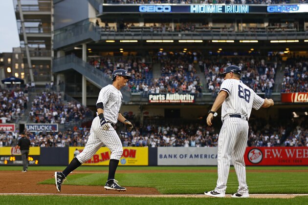 NEW YORK, NY - JUNE 17:  DJ LeMahieu #26 of the New York Yankees celebrates with Phil Nevin #88 of the New York Yankees after hitting a two run home run against the Tampa Bay Rays during the third inning at Yankee Stadium on June 17, 2019 in the Bronx borough of New York City. (Photo by Adam Hunger/Getty Images)