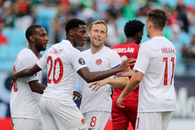 CHARLOTTE, NC - JUNE 23:  Jonathan David of Canada celebrates after scoring a goal to make it 7-0 during the Group A 2019 CONCACAF Gold Cup match between Canada v Cuba at Bank of America Stadium on June 23, 2019 in Charlotte, North Carolina. (Photo by Matthew Ashton - AMA/Getty Images)