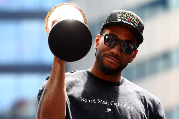 TORONTO, ON - JUNE 17:  Kawhi Leonard #2 of the Toronto Raptors holds the MVP trophy during the Toronto Raptors Victory Parade on June 17, 2019 in Toronto, Canada. The Toronto Raptors beat the Golden State Warriors 4-2 to win the 2019 NBA Finals.  NOTE TO USER: User expressly acknowledges and agrees that, by downloading and or using this photograph, User is consenting to the terms and conditions of the Getty Images License Agreement.  (Photo by Vaughn Ridley/Getty Images)