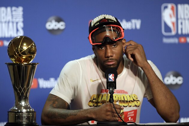 Toronto Raptors forward Kawhi Leonard speaks at a news conference alongside the NBA Finals Most Valuable Player trophy after the Raptors defeated the Golden State Warriors in Game 6 of basketball's NBA Finals in Oakland, Calif., Thursday, June 13, 2019. (AP Photo/Ben Margot)