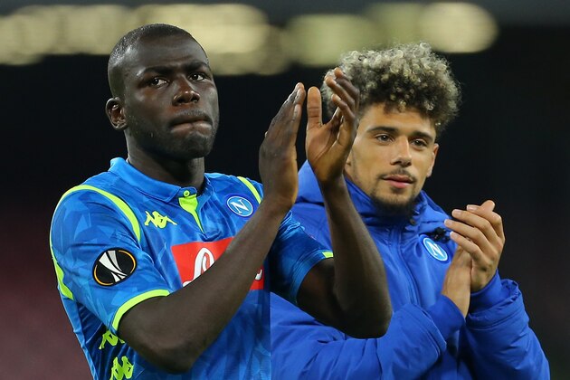 Napoli's Senegalese defender Kalidou Koulibaly (L) and Napoli's French-Moroccan defender Kevin Malcuit acknowledge the public at the end of the UEFA Europa League quarter-final second leg football match Napoli vs Arsenal on April 18, 2019 at the San Paolo stadium in Naples. (Photo by Carlo Hermann / AFP)        (Photo credit should read CARLO HERMANN/AFP/Getty Images)