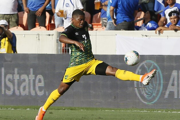 HOUSTON, TEXAS - JUNE 21: Leon Bailey #7 of Jamaica stretches out to control the ball during the CONCACAF Gold Cup Group C  game between El Salvador and Jamaica at BBVA Stadium on June 21, 2019 in Houston, Texas. (Photo by Bob Levey/Getty Images)
