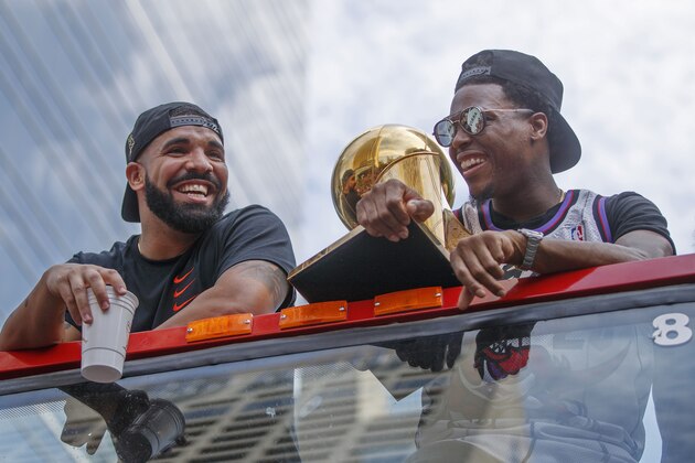 TORONTO, ON - JUNE 17: Rapper Drake and Kyle Lowry #7 of the Toronto Raptors look on from the team bus during the Toronto Raptors Championship Victory Parade on June 17, 2019 in Toronto, Ontario. NOTE TO USER: User expressly acknowledges and agrees that, by downloading and/or using this photograph, user is consenting to the terms and conditions of Getty Images License Agreement. Mandatory Copyright Notice: Copyright 2019 NBAE (Photo by Mark Blinch/NBAE via Getty Images) TORONTO, ON - JUNE 17: Rapper Drake and Kyle Lowry #7 of the Toronto Raptors look on from the team bus during the Toronto Raptors Championship Victory Parade on June 17, 2019 in Toronto, Ontario. NOTE TO USER: User expressly acknowledges and agrees that, by downloading and/or using this photograph, user is consenting to the terms and conditions of Getty Images License Agreement. Mandatory Copyright Notice: Copyright 2019 NBAE (Photo by Mark Blinch/NBAE via Getty Images)