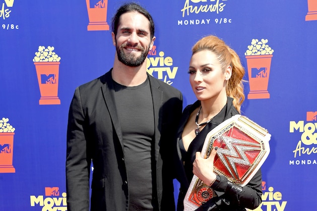 SANTA MONICA, CALIFORNIA - JUNE 15: Seth Rollins and Becky Lynch attend the 2019 MTV Movie and TV Awards at Barker Hangar on June 15, 2019 in Santa Monica, California. (Photo by Frazer Harrison/Getty Images for MTV)