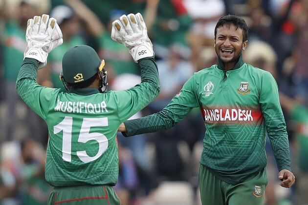 Bangladesh's Shakib Al Hasan (R) celebrates with teammate Mushfiqur Rahim after the dismissal of Afghanistan's Najibullah Zadran during the 2019 Cricket World Cup group stage match between Bangladesh and Afghanistan at the Rose Bowl in Southampton, southern England, on June 24, 2019. (Photo by Adrian DENNIS / AFP) / RESTRICTED TO EDITORIAL USE        (Photo credit should read ADRIAN DENNIS/AFP/Getty Images)