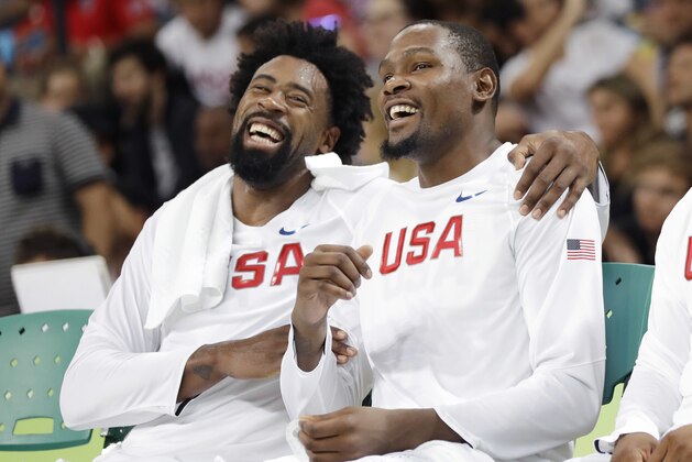 United States' DeAndre Jordan, left, jokes with teammate Kevin Durant, right, during a men's basketball game against Venezuela at the 2016 Summer Olympics in Rio de Janeiro, Brazil, Monday, Aug. 8, 2016. (AP Photo/Eric Gay)