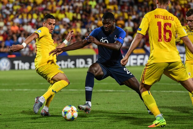 France's forward Marcus Thuram (C) and Romania's defender Cristian Manea (L) go for the ball during the Group C match of the U21 European Football Championships between France and Romania on June 24, 2019 at the Dino-Manuzzi stadium in Cesena. (Photo by Miguel MEDINA / AFP)        (Photo credit should read MIGUEL MEDINA/AFP/Getty Images)