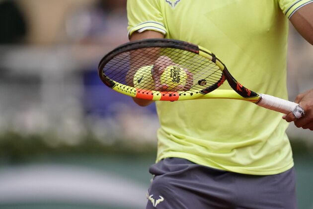Spain's Rafael Nadal holds balls during his men's singles quarter-final match against Japan's Kei Nishikori on day ten of The Roland Garros 2019 French Open tennis tournament in Paris on June 4, 2019. (Photo by Kenzo TRIBOUILLARD / AFP)        (Photo credit should read KENZO TRIBOUILLARD/AFP/Getty Images)