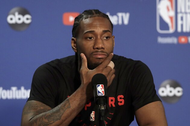 Toronto Raptors forward Kawhi Leonard speaks to reporters before a team practice in Oakland, Calif., Wednesday, June 12, 2019. The Raptors are scheduled to play the Golden State Warriors in Game 6 of basketball's NBA Finals on Thursday. (AP Photo/Jeff Chiu)