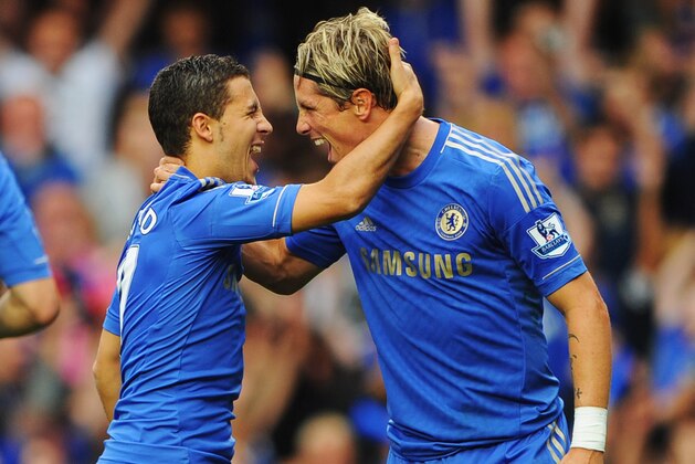 LONDON, ENGLAND - AUGUST 25:  Eden Hazard of Chelsea (L) celebrates with Fernando Torres as he scores their first goal from the penalty spot during the Barclays Premier League match between Chelsea and Newcastle United at Stamford Bridge on August 25, 2012 in London, England.  (Photo by Michael Regan/Getty Images)