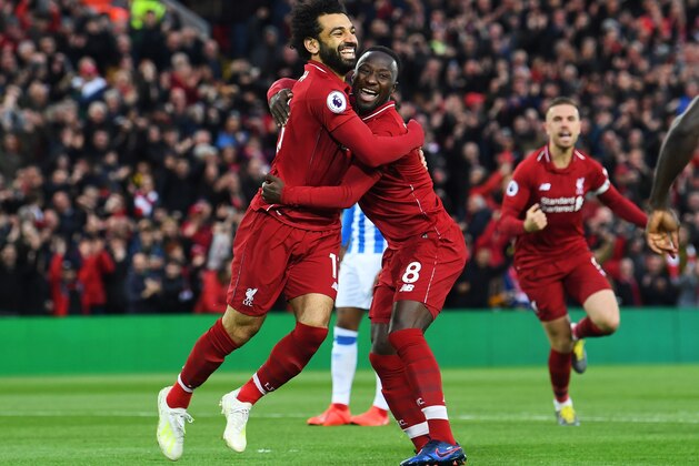 LIVERPOOL, ENGLAND - APRIL 26:  Naby Keita of Liverpool (8) celebrates after scoring his team's first goal with Mohamed Salah during the Premier League match between Liverpool FC and Huddersfield Town at Anfield on April 26, 2019 in Liverpool, United Kingdom. (Photo by Michael Regan/Getty Images)