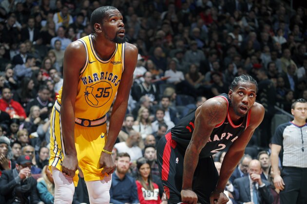TORONTO, CANADA - NOVEMBER 29: Kevin Durant #35 of the Golden State Warriors and Kawhi Leonard #2 of the Toronto Raptors look on during the game on November 29, 2018 at Scotiabank Arena in Toronto, Ontario, Canada. NOTE TO USER: User expressly acknowledges and agrees that, by downloading and/or using this photograph, user is consenting to the terms and conditions of the Getty Images License Agreement. Mandatory Copyright Notice: Copyright 2018 NBAE (Photo by Mark Blinch/NBAE via Getty Images)