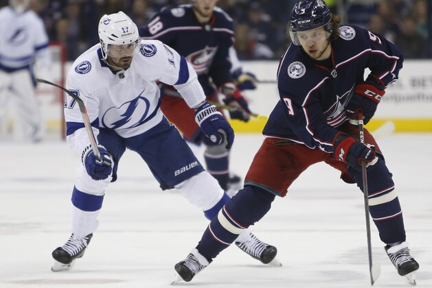 Columbus Blue Jackets' Artemi Panarin, right, of Russia, keeps the puck away from Tampa Bay Lightning's Alex Killorn during the first period of Game 3 of an NHL hockey first-round playoff series Sunday, April 14, 2019, in Columbus, Ohio. (AP Photo/Jay LaPrete)
