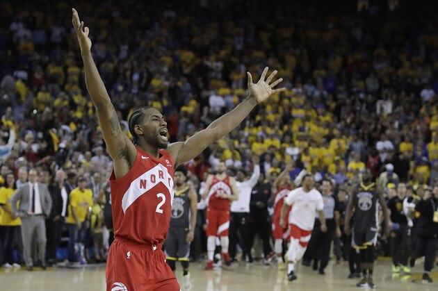 Toronto Raptors forward Kawhi Leonard celebrates after the Raptors defeated the Golden State Warriors in Game 6 of basketball's NBA Finals in Oakland, Calif., Thursday, June 13, 2019. (AP Photo/Ben Margot)