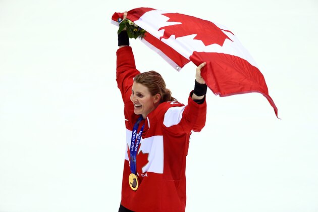SOCHI, RUSSIA - FEBRUARY 20:  Gold medalist Hayley Wickenheiser #22 of Canada celebrates during the flower ceremony for the Ice Hockey Women's Gold Medal Game on day 13 of the Sochi 2014 Winter Olympics at Bolshoy Ice Dome on February 20, 2014 in Sochi, Russia.  (Photo by Doug Pensinger/Getty Images)